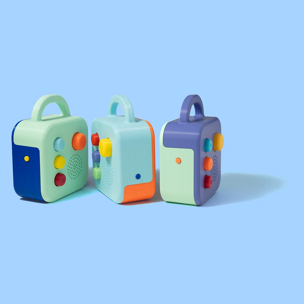 Three Koobiba audio players side by side, in different colours